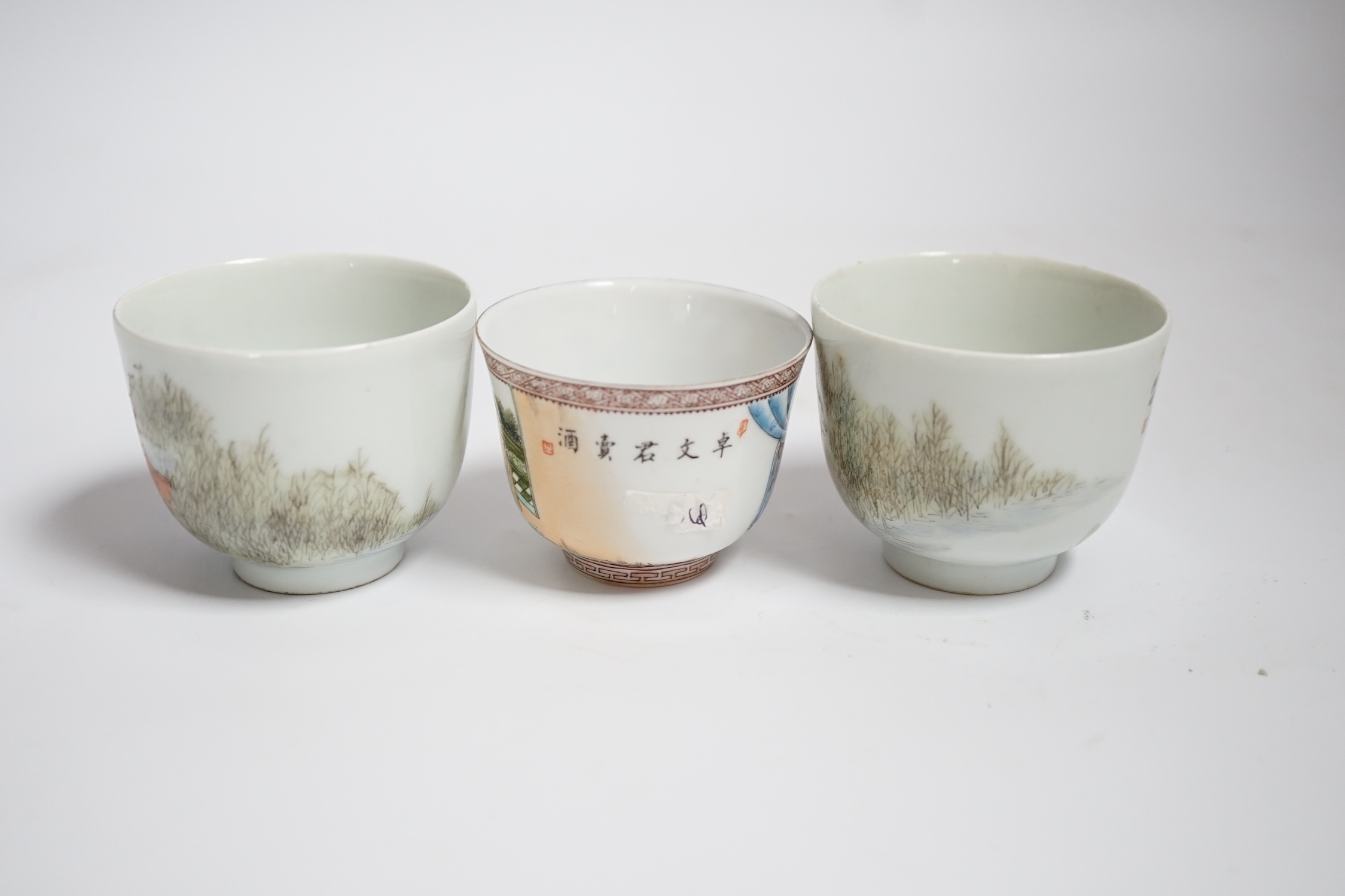 Three Chinese enamelled porcelain tea bowls, largest 5cm high